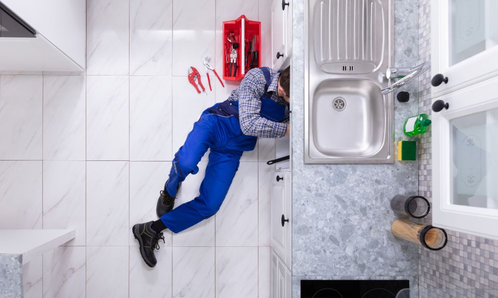 plumber-under-sink